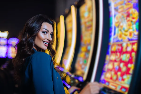 A close-up shot of golden coins falling around a spinning roulette wheel, representing immersive casino action at JETA9.