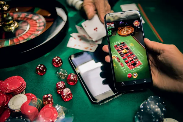 A person using their device against a moody casino-themed background, illustrating the smooth re-entry process at JETA9.
